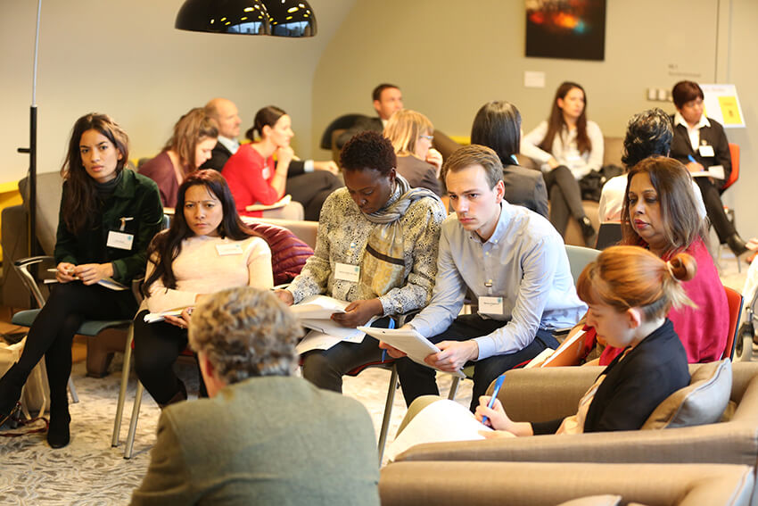 A group of conference participants at the rotating discussions